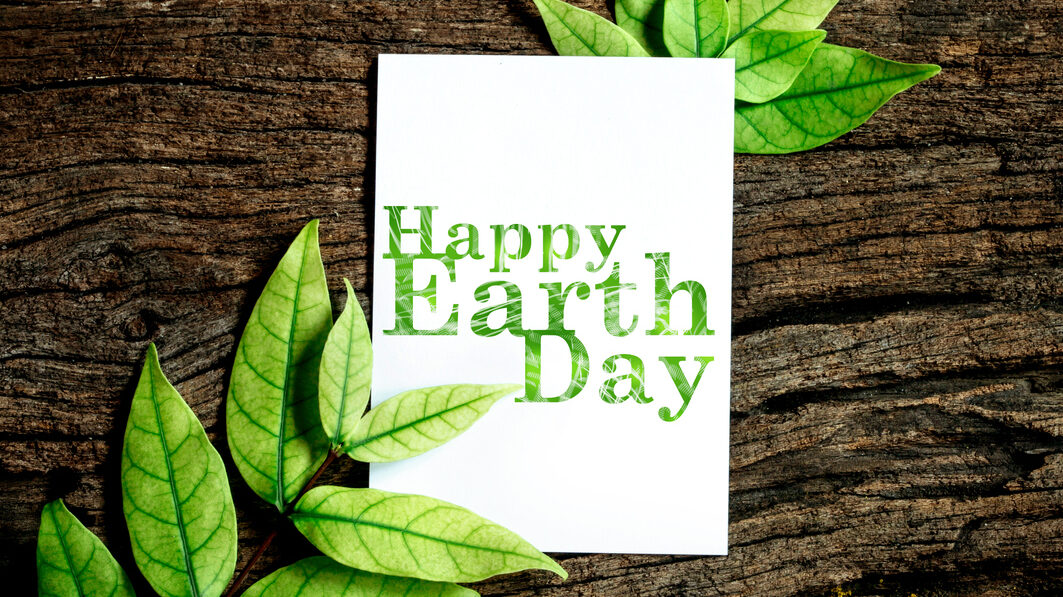 Happy Earth Day Paper Sheet With Fresh Spring Green Leafs