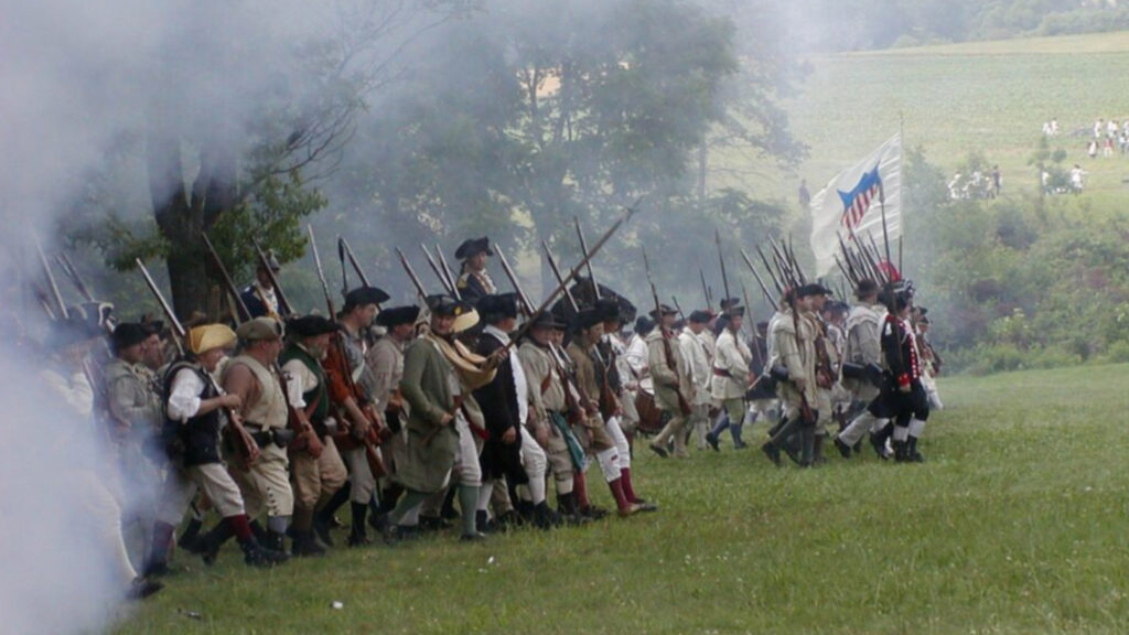Revolutionary War reenactors marching