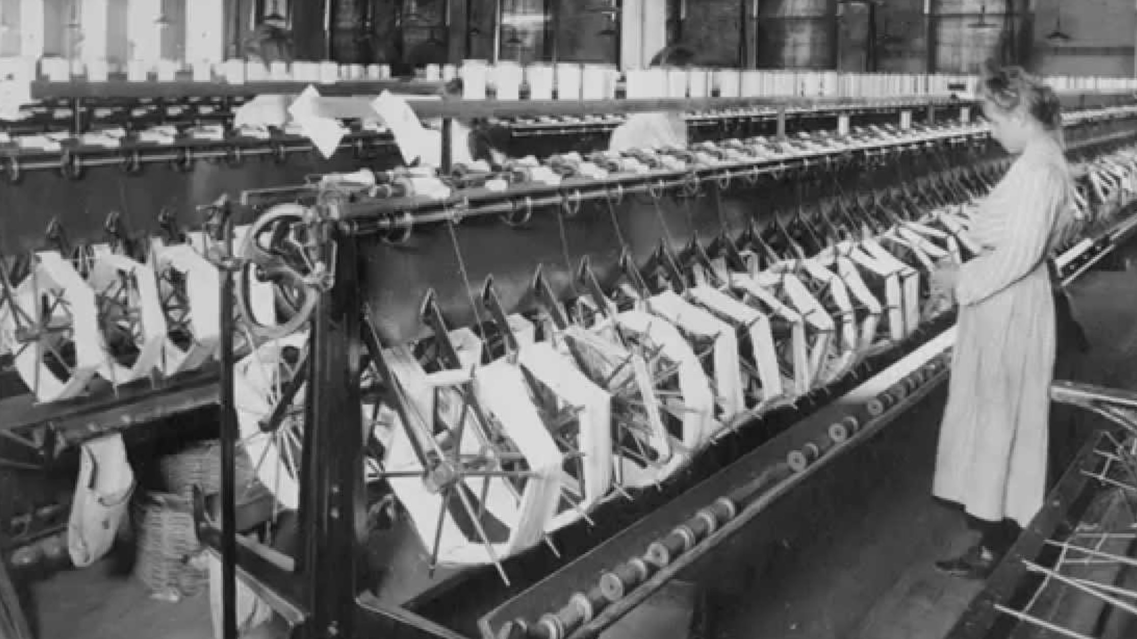 A woman making silk in a factory