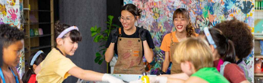 Group Of Diversity School Children Learning Acrylic Art Together In Art Class.