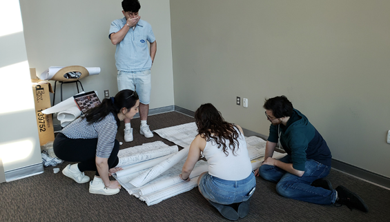 Kean students building forensic wall, 2025